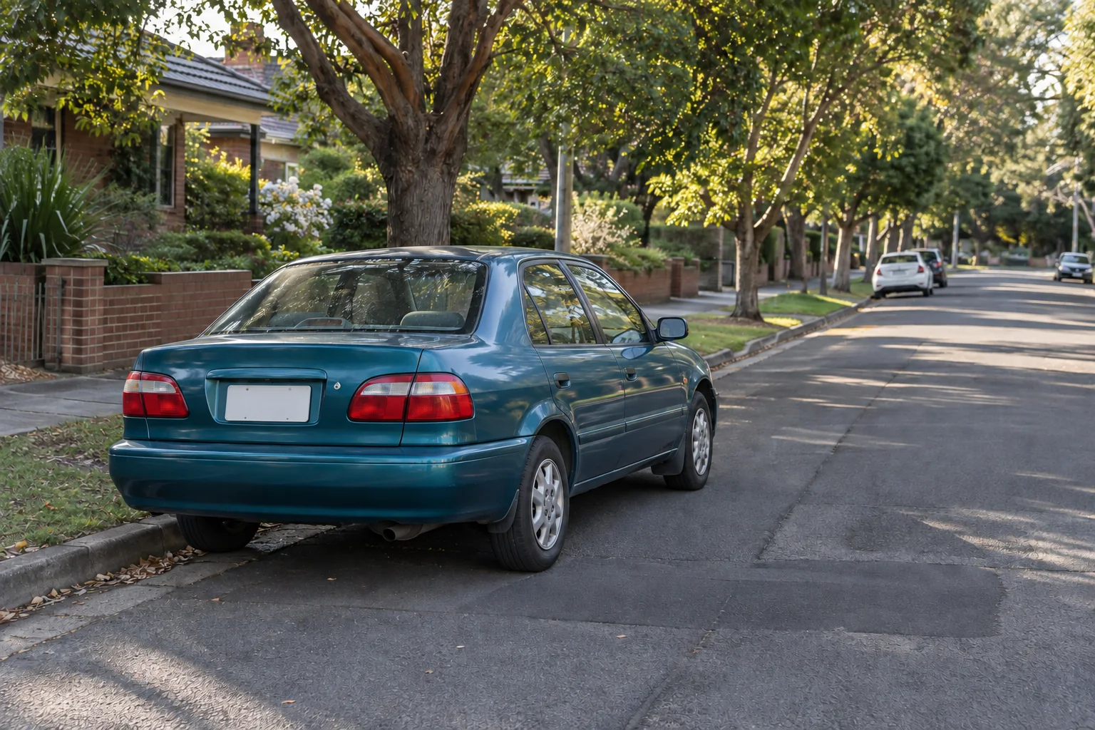 Older teal sedan in working condition